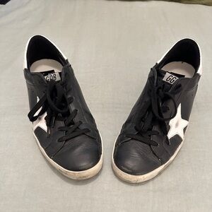 Golden goose super star.  Size 38 (8).  Black with white accents.